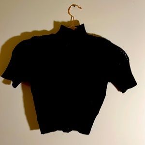 Black knitted short sleeve top.